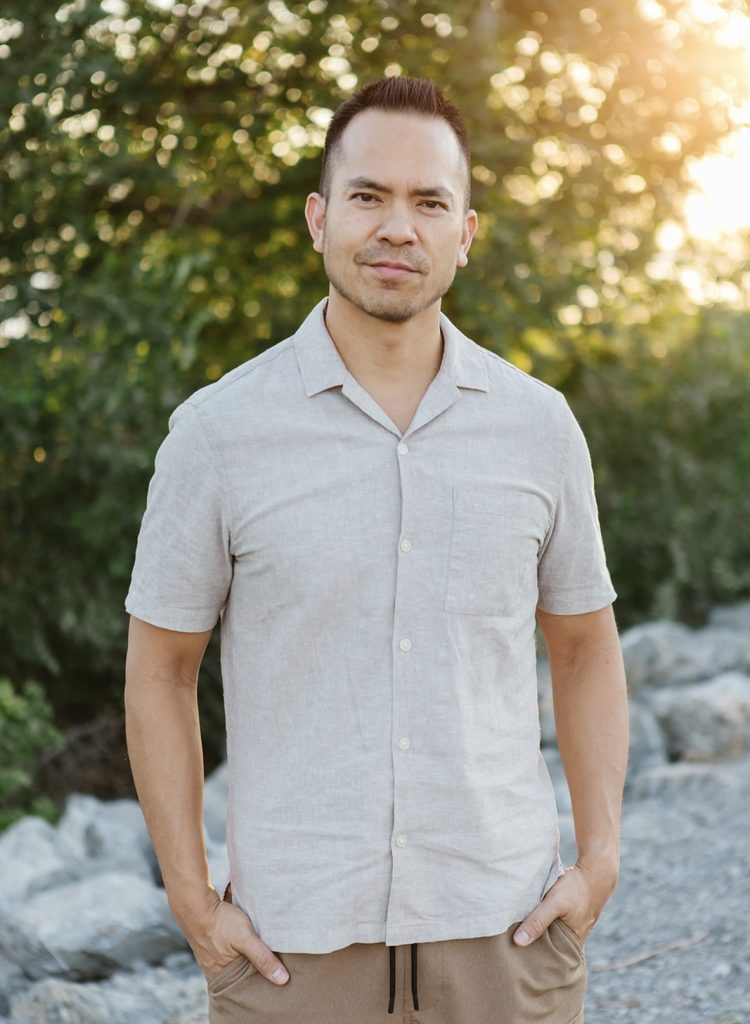 Photograph of Kyle Reyes standing outdoors
